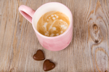 Fototapeta na wymiar Cup of coffee on wooden background