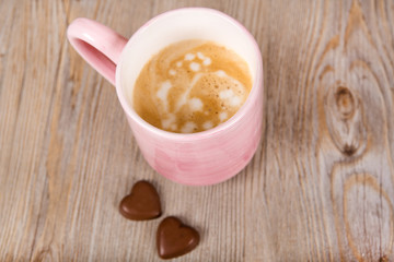 Cup of coffee on wooden background
