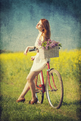 Fototapeta na wymiar Girl on a bike in the countryside.