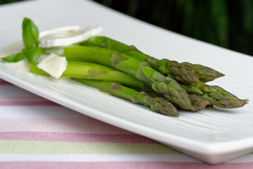 Fresh asparagus with Brie cheese and olive oil