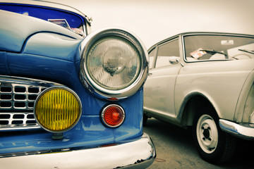 Front of old blue car, sixties style, retro