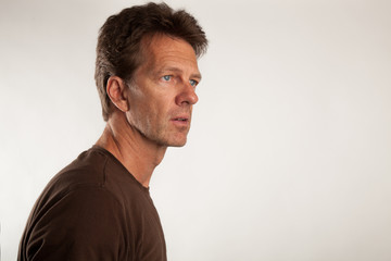 attractive man looks surprised