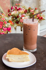 Cocoa ice and cake with flower background