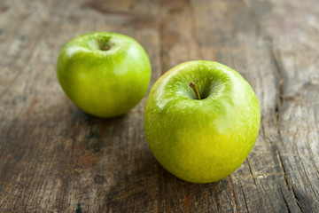Green apples on wood table