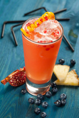 Red drink on a blue background