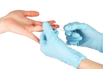 Test tubes with blood in hand isolated on white
