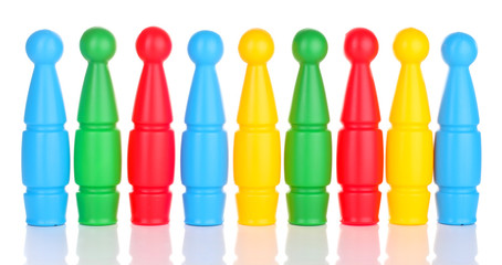 Colorful plastic skittles of toy bowling isolated on white