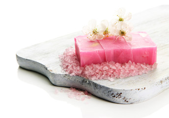 Natural handmade soap on wooden desk, isolated on white