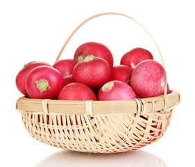 Small garden radish in wicker basket isolated on white