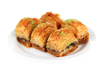 Sweet baklava on plate isolated on white