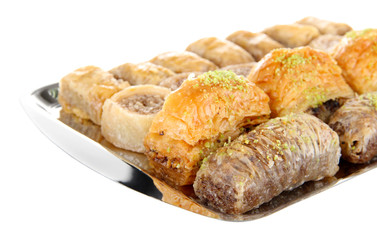 Sweet baklava on tray isolated on white