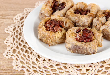 Sweet baklava on plate on table close-up