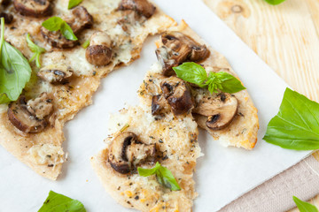 pieces of pita bread with mushrooms and mozzarella