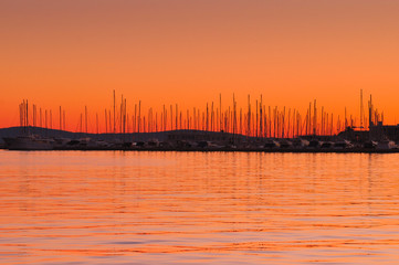 Orange Sky and Boats in Horizon