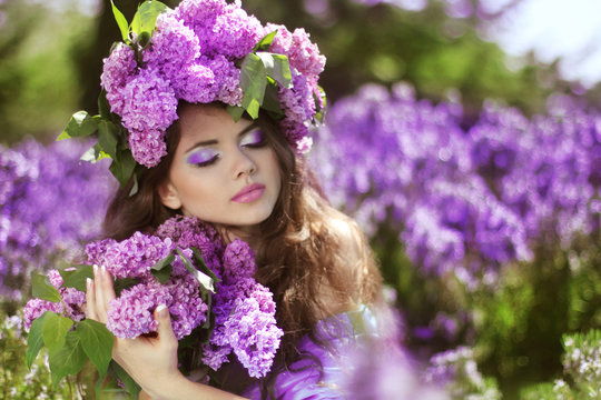 Beautiful Young Woman In Lilac Flowers, Outdoors Portrait