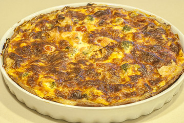 Homemade quiche pie with salmon, cheese, broccoli