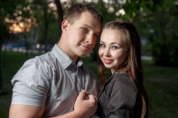 Fototapeta premium Young couple in love side view