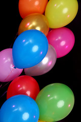 Many bright balloons close-up