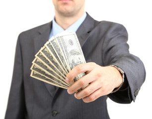 Young businessman with money isolated on white.