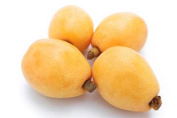 fresh loquat medlar fruit on white background