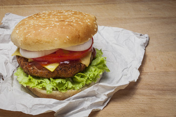 Burger over a wooden background