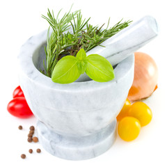 herbs in mortar with tomato