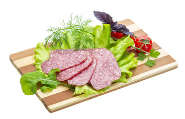 Sausages with salad and basil