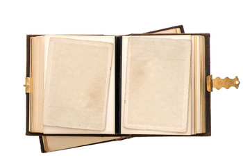 open antique album with empty photo cards