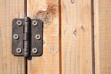 Door hinge on wooden door