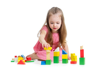 child girl playing with block toys over white background © Oksana Kuzmina