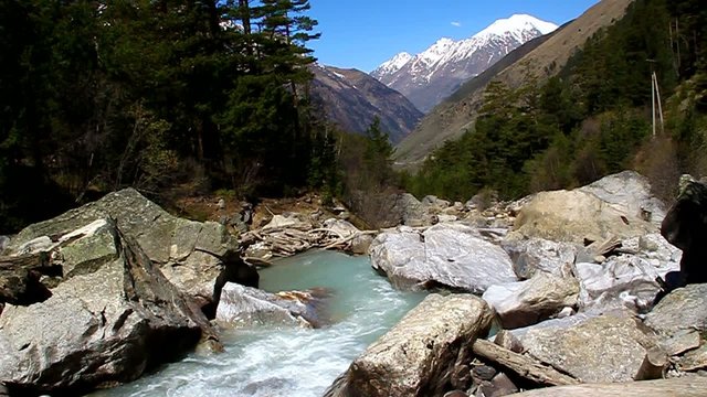 Mountain river flowing in the valley