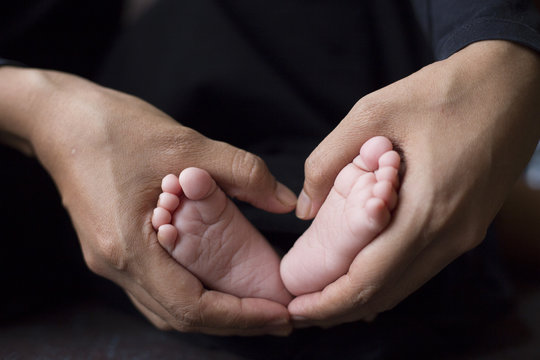 baby's foot in mother hands