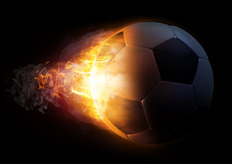 Fototapeta premium Football in Fire on black background