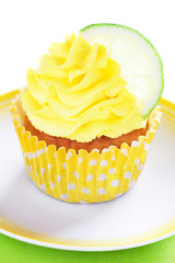 Lime cupcake with lemon cream, selective focus