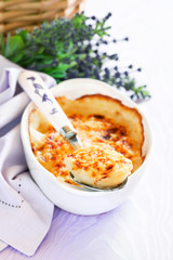Boiled eggs baked with sauce and cheese (Gratin provencal eggs)
