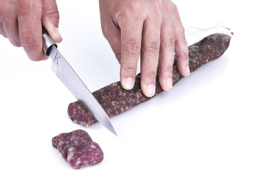 Cutting spanish sausage