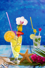 Mojito and lemon lime Cocktails in tropical blue wood