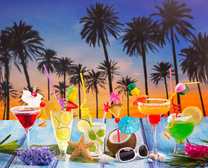 Colorful many tropical Cocktails in tropical blue wood