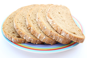 Slices of rye bread and colorful plate
