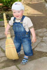 the boy with a broom
