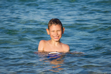 Boy enjoing in sea water