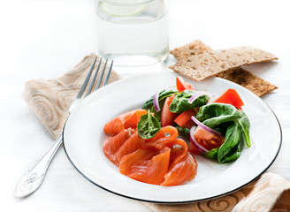 Salted salmon with fresh green salad, crisps on side