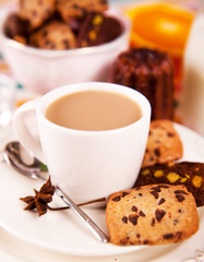 Chocolate cookies, cannele and cappuccino