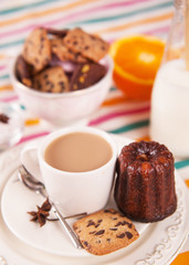cup of hot coffee with milk and sweet cookie