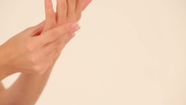 Woman using moisturizing hand cream. Close-up