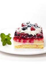 Piece of cake with fresh berry assortment