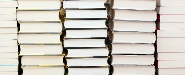 Obraz premium Stacks of new books
