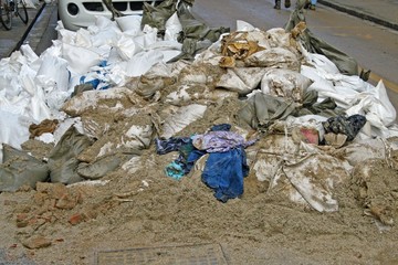 sandbags piled in the street after the big flood