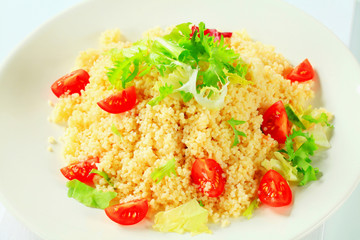 Couscous with salad greens and tomatoes