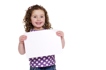 Young girl holding up a blank sign
